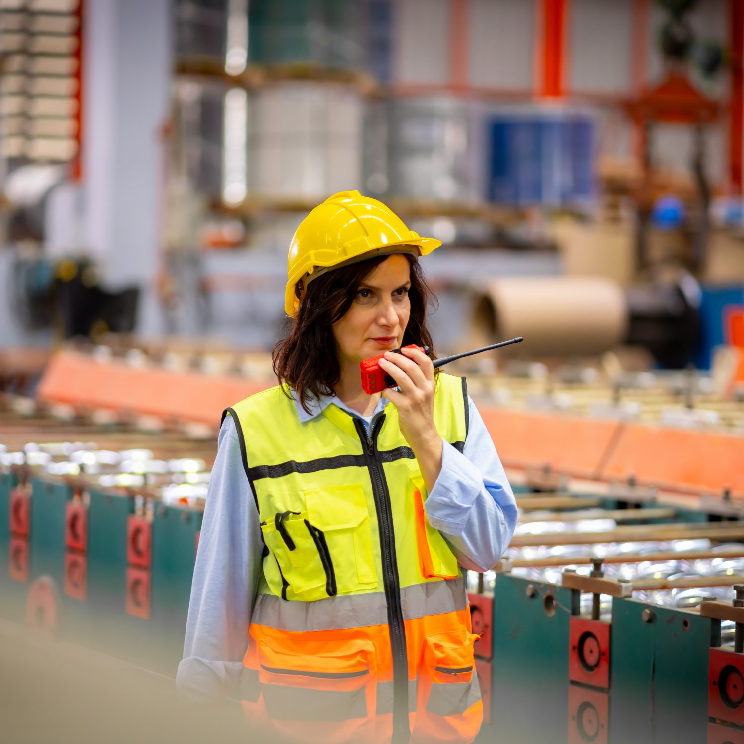 Young female engineer in metal sheet factory Responsible work is being inspected at the actual work site. Work professionally and happily